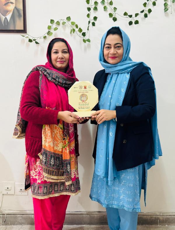 Aysha Hanif being presented with the Shield of Honor at GIS Day